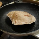 Coriander Chapatti puffing up in a hot pan