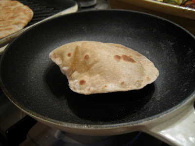Coriander Chapatti puffing up in a hot pan