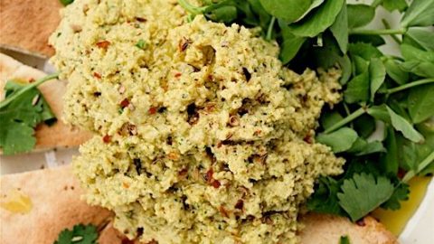 Lime and coriander hummus with triangles of pitta bread and lambs lettuce salad.