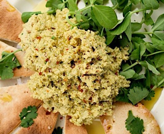 Lime and coriander hummus with triangles of pitta bread and lambs lettuce salad.