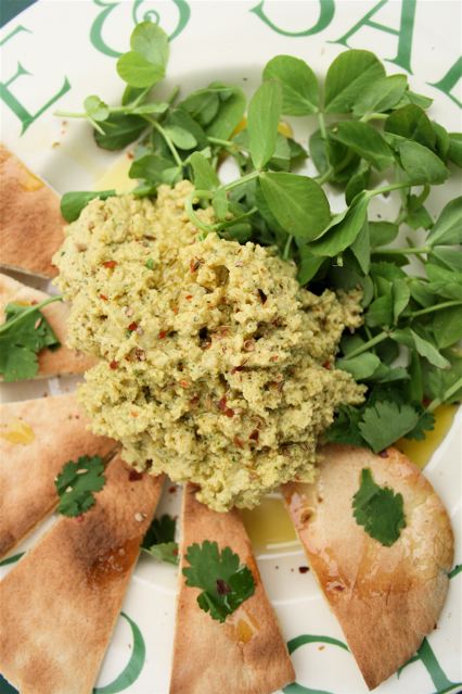Lime and coriander hummus with triangles of pitta bread and lambs lettuce salad.