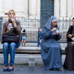 Eat Pray Love movie still: Julia Roberts eating ice cream sat next to nuns in Rome.