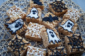 Halloween Marshmallow Squares decorated with cobwebs, ghosts and bats