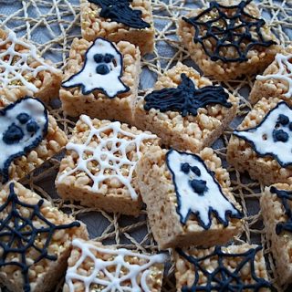 Halloween Marshmallow Squares decorated with cobwebs, ghosts and bats