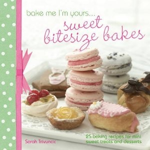 My Book Cover of "Bake Me I'm Yours... Sweet Bitesize Bakes" by Sarah Trivuncic; image shows a selection of small cakes and patisserie. The book has a green polka dot spine edged with pink ribbon and a bow.