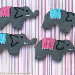 Elephant cookies decorated with grey sugarpaste and iced pink and blue decoration
