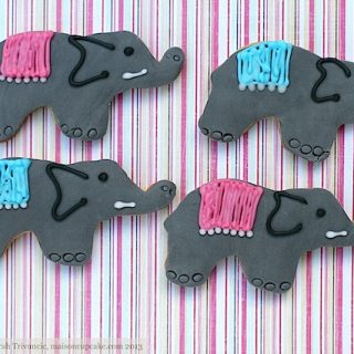 Elephant cookies decorated with grey sugarpaste and iced pink and blue decoration