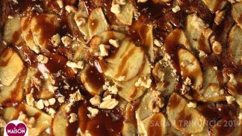 Close up of Toffee Apple Tart showing apple slices, toffee sauce, chopped nuts