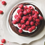 Joanne Harris Flourless Chocolate Cake covered in Raspberries