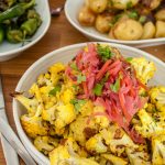 Spicy roasted cauliflower florets with Red Slaw topping