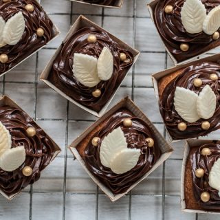 autumn cupcakes - with chocolate icing and white chocolate leaves and little gold edible balls