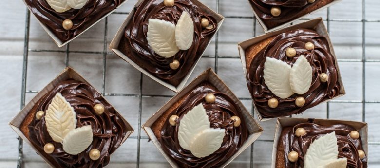 autumn cupcakes - with chocolate icing and white chocolate leaves and little gold edible balls