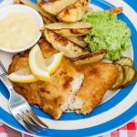 Combi Microwave Potato wedges served with battered cod and mushy peas