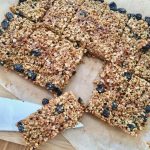 Twelve raisin flapjacks cut into rectangles