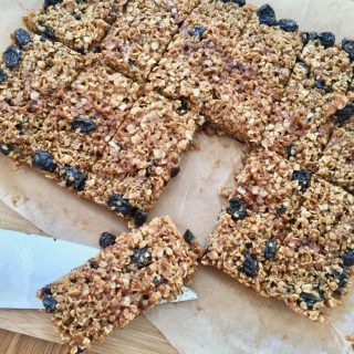 Twelve raisin flapjacks cut into rectangles