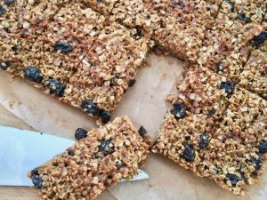 Twelve raisin flapjacks cut into rectangles
